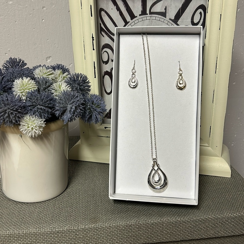 New in box silver necklace and earrings
